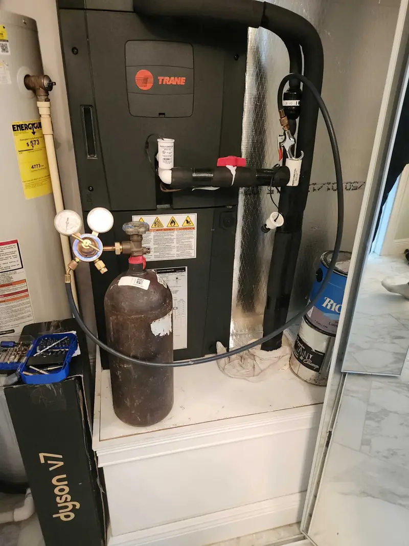 Gauges and recovery tank connected to indoor equipment