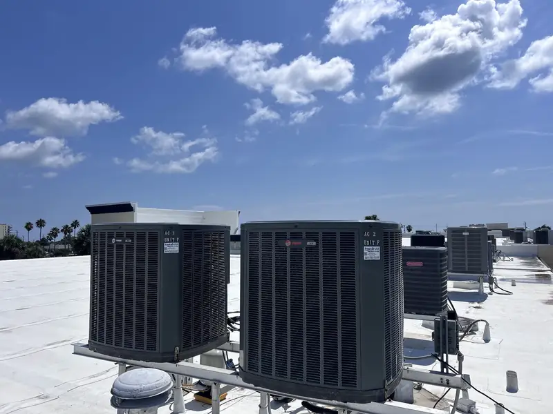 Bank of rooftop condensers on a commercial property