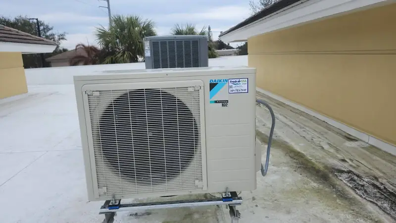 Mini-split condenser mounted on a rooftop
