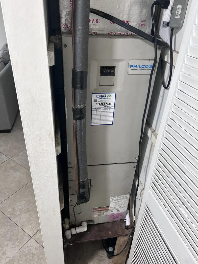 Air handler installed alongside a water heater