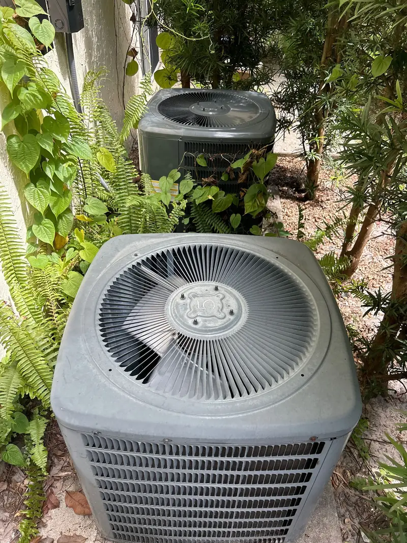 Condenser unit set in a landscaped garden bed